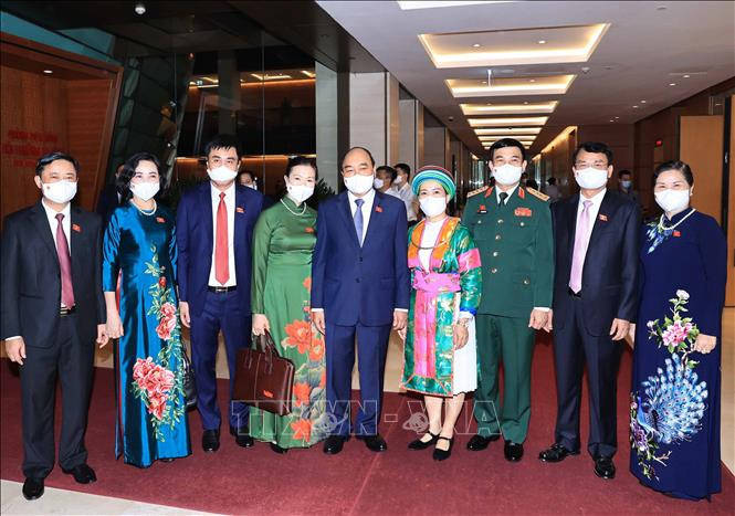 Chủ tịch nước Nguyễn Xuân Phúc và các đại biểu. Ảnh: Thống Nhất - TTXVN Khai mạc trọng thể Kỳ họp thứ nhất, Quốc hội khóa XV ảnh 7