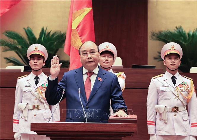 Chủ tịch nước Nguyễn Xuân Phúc tuyên thệ nhậm chức trước Quốc hội, đồng bào và cử tri cả nước. Ảnh: Thống Nhất/TTXVN Nghị quyết bầu Chủ tịch nước nhiệm kỳ 2021 - 2026 ảnh 1