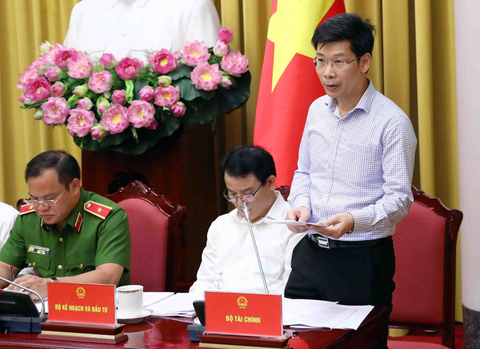 Cục trưởng Cục quản lý giá (Bộ Tài chính) Nguyễn Minh Tiến thông tin những điểm quan trọng của Luật Giá (sửa đổi). Ảnh: Phạm Kiên - TTXVN Công bố Lệnh của Chủ tịch nước về 8 Luật vừa được Quốc hội thông qua ảnh 3