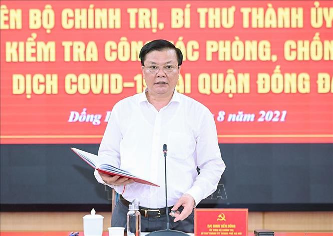 Bí thư Thành ủy Hà Nội Đinh Tiến Dũng phát biểu tại buổi làm việc với Quận ủy Đống Đa. Ảnh: TTXVN Bí thư Thành ủy Hà Nội Đinh Tiến Dũng: Sự lơ là, thiếu tập trung sẽ làm cho dịch diễn biến dai dẳng ảnh 1