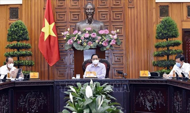 Thủ tướng Phạm Minh Chính chủ trì cuộc họp Thường trực Chính phủ về công tác tổ chức bầu cử trong bối cảnh dịch bệnh COVID-19. Ảnh : TTXVN Thủ tướng Chính phủ yêu cầu giải quyết dứt điểm các ổ dịch, nhanh chóng ổn định tình hình ảnh 1