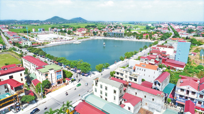 Một góc thị trấn Bích Động (Việt Yên) ở tỉnh Bắc Giang. Ảnh : baobacgiang.com.vn Công nhận 2 huyện Tứ Kỳ và Yên Dũng đạt chuẩn nông thôn mới ảnh 1