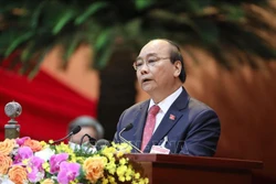 Đồng chí Nguyễn Xuân Phúc, Uỷ viên Bộ Chính trị, Thủ tướng Chính phủ thay mặt Đoàn Chủ tịch đọc Diễn văn khai mạc Đại hội. Ảnh: TTXVN