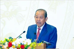 Phó Thủ tướng Thường trực Trương Hoà Bình trình bày báo cáo tóm tắt về tình hình thực hiện kế hoạch phát triển KT - XH năm 2020 và 5 năm 2016 - 2020, dự kiến nhiệm vụ thời gian tới. Ảnh: Thống Nhất – TTXVN