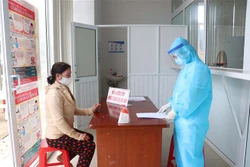 Bệnh viện phân luồng và phòng khám riêng khi phát hiện trường hợp có yếu tố dịch tễ hoặc có triệu chứng bệnh. Ảnh: Tuấn Anh - TTXVN