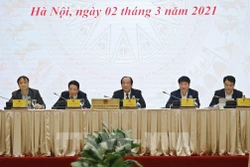 Bộ trưởng, Chủ nhiệm, Người Phát ngôn Chính phủ Mai Tiến Dũng (ngồi giữa) chủ trì Họp báo Chính phủ thường kỳ tháng 2 năm 2021. Ảnh: Dương Giang-TTXVN