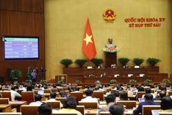 Quốc hội biểu quyết thông qua Luật Nhà ở (sửa đổi). Ảnh: Doãn Tấn - TTXVN