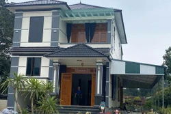 Ngôi nhà khang trang của gia đình ông Cao Như Tám tại xã Điền Lư (Bá Thước, Thanh Hóa) được xây dựng từ số tiền anh Cao Văn Nguyên đi xuất khẩu lao động gửi về. Ảnh: Nguyễn Nam - TTXVN